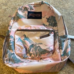Girls backpack brand name Jansport very good condition, clean , nice patterns!
